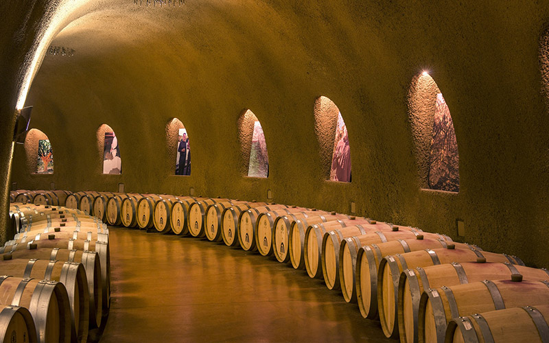 Barrels in a wine cellar cave in Napa Valley California