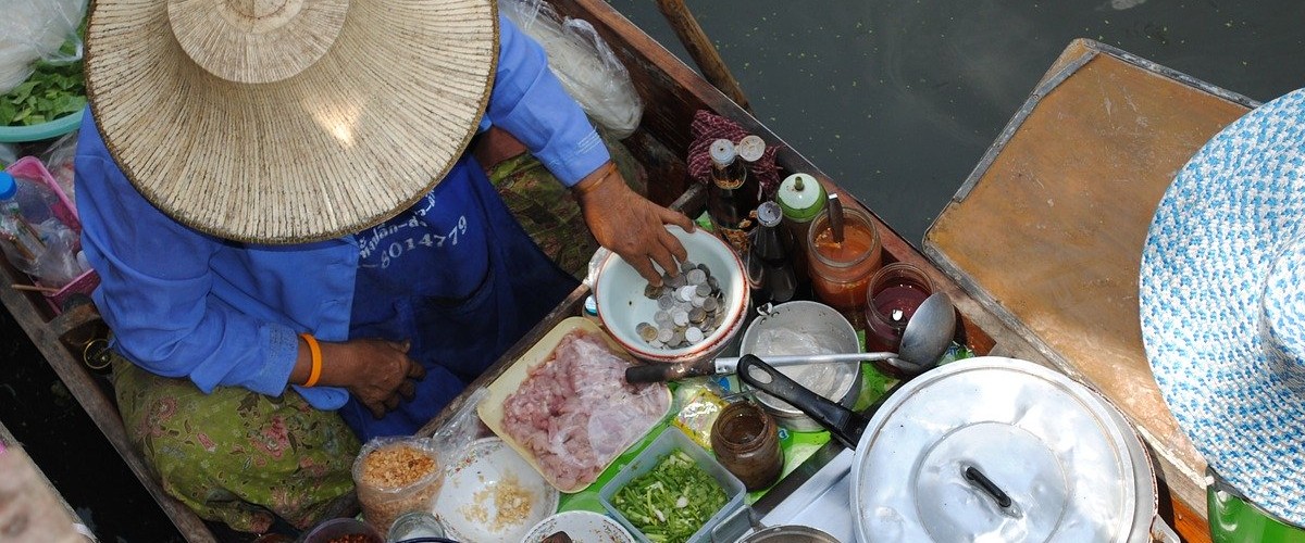 street food on boat in asia, virtual travel escape during covid-19