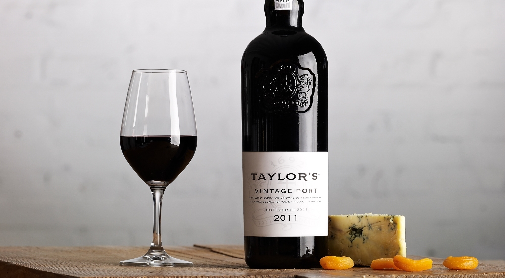 Taylor's vintage port on a board with blue cheese and dried apricots